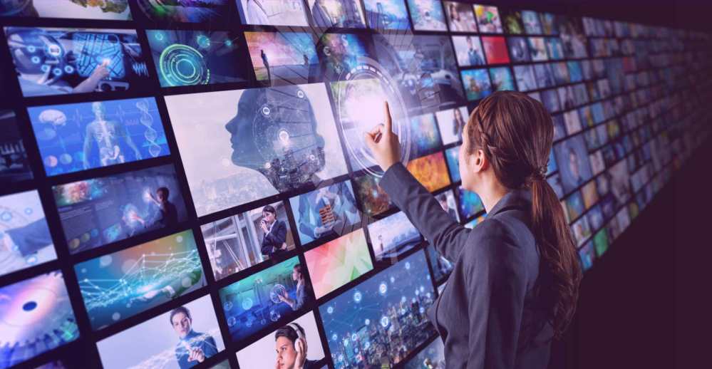 woman pointing at an AI screen with different images and she is selecting one with her finger