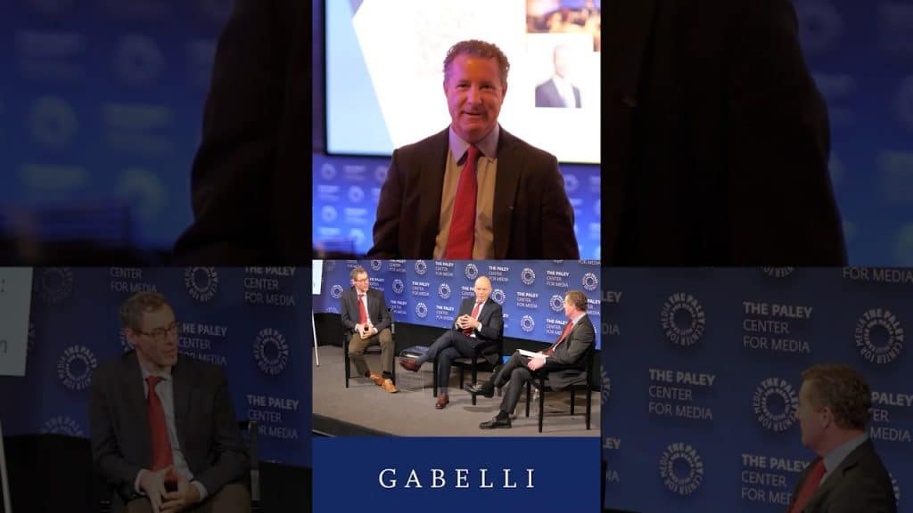 a photo collage from the 852 symposium of people who attended and speakers on stage