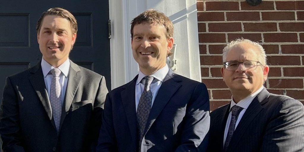 photo of three people smiling for the camera